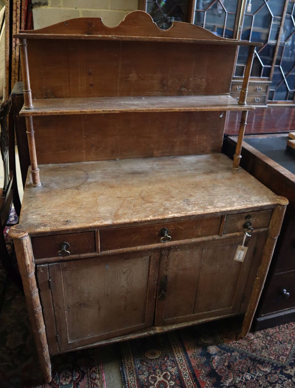 A Regency pine chiffonier with simulated bamboo legs, width 91cm depth 48cm height 128cm